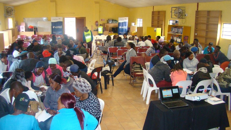 Entrepreneurship workshop participants engaged in group work 